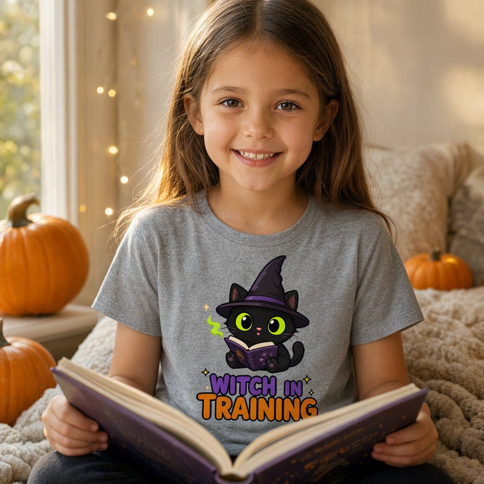 Child wearing the Witch in Training Black Cat Kids Halloween T-Shirt